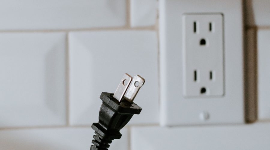 Unplugging a cord from an outlet, one way to help the environment without local electronics recycling