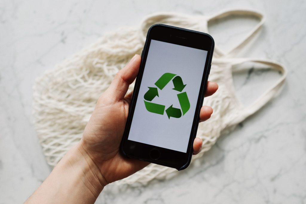 A smart phone displaying the local e-waste recycling symbol